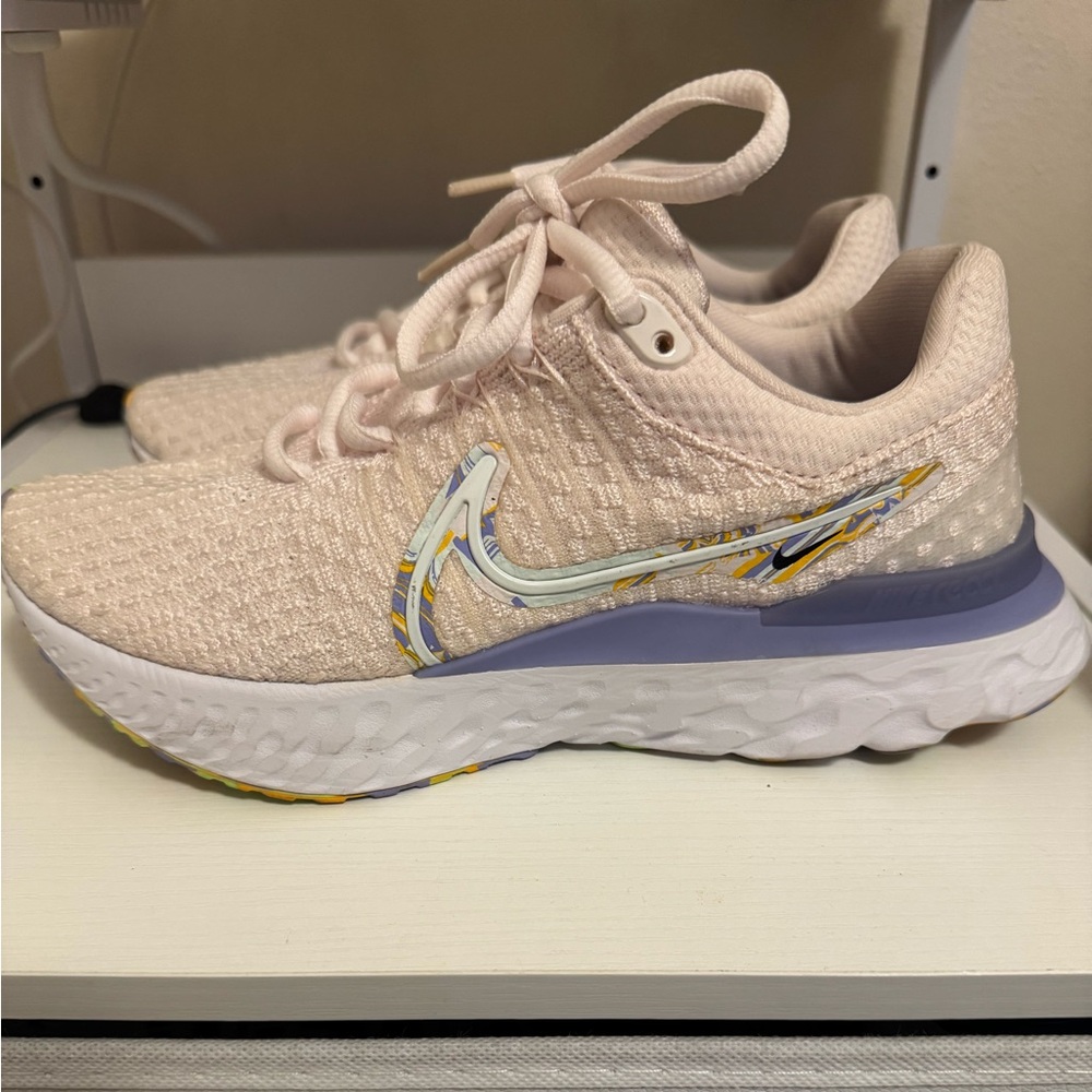 Nike Light Pink Knit Sneakers with Purple and Yellow Accents